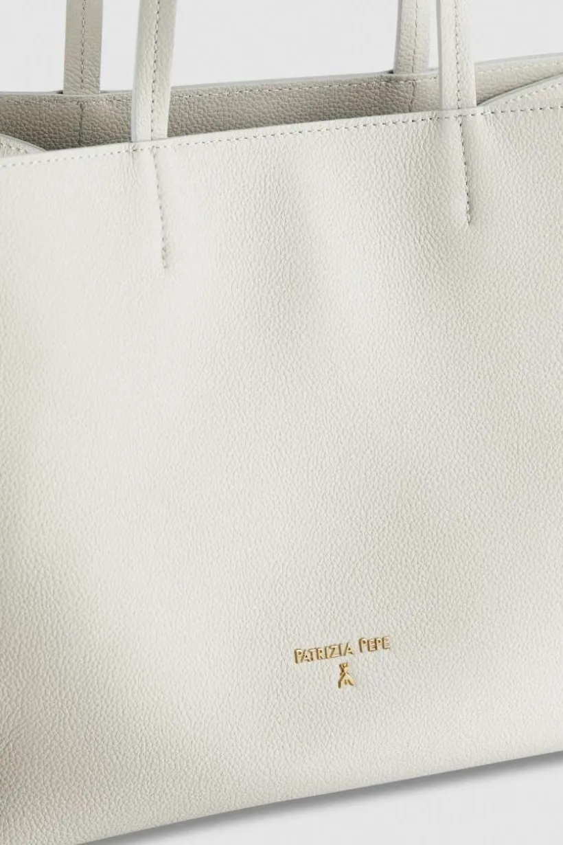 Borsa shopping in pelle martellata