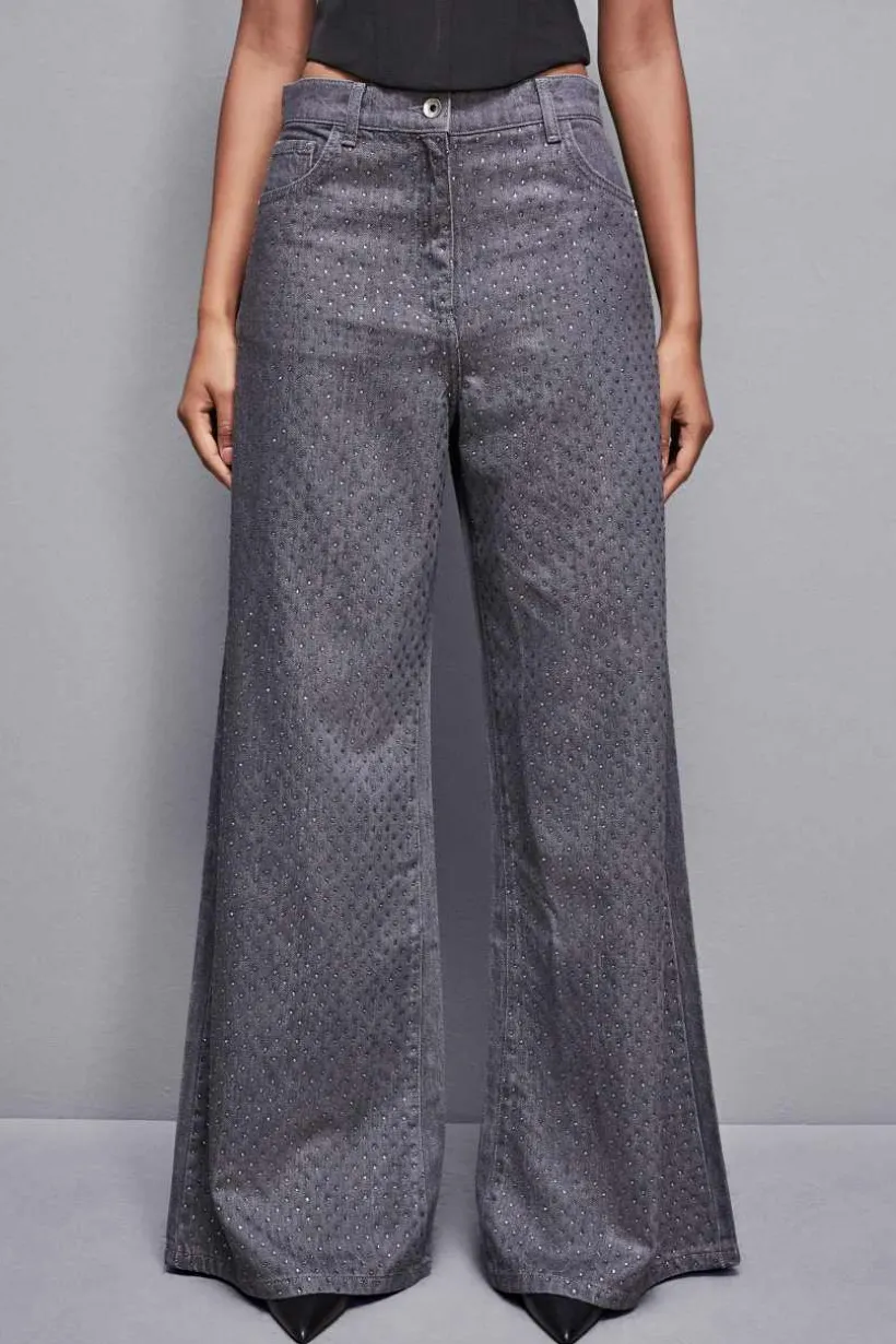 Jeans grigio vita bassa wide leg con strass