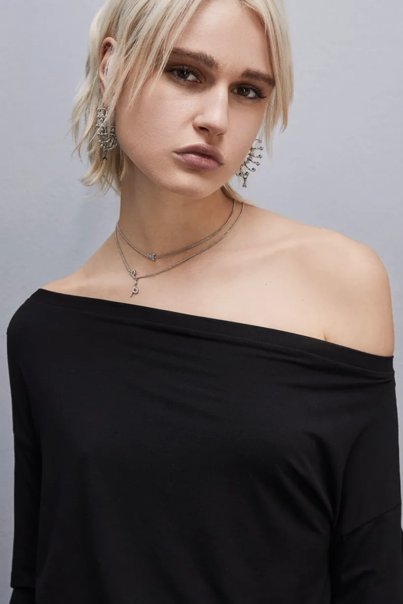 Maglia con spalla scesa "Essential"