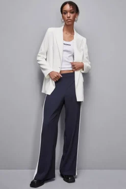 Pantalone vita bassa con banda colorata