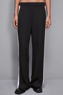 Pantalone vita bassa con banda colorata