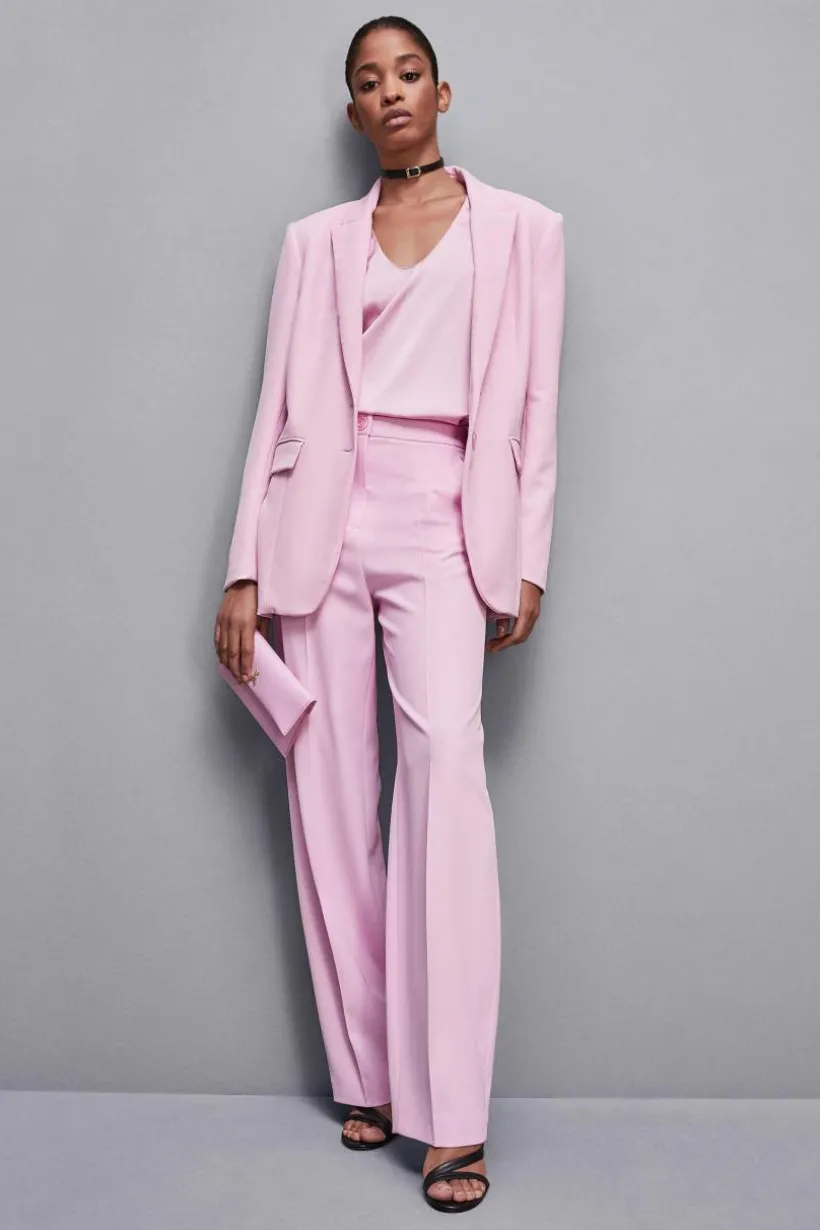 Pantaloni con pieghe in tessuto stretch