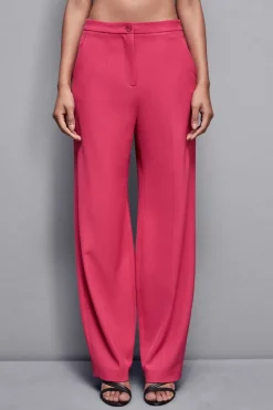 Pantaloni con pieghe in tessuto stretch