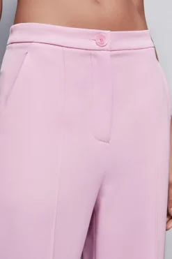Pantaloni con pieghe in tessuto stretch