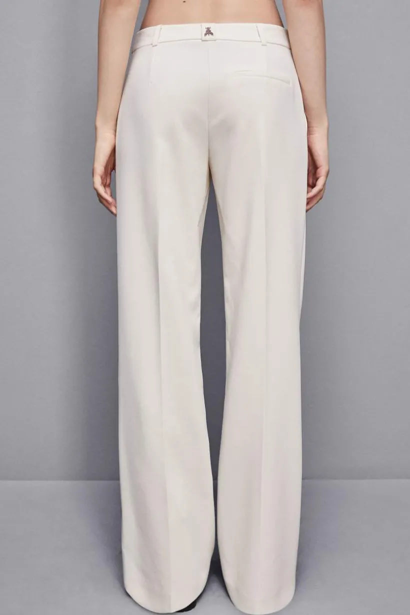 Pantaloni vita bassa in twill