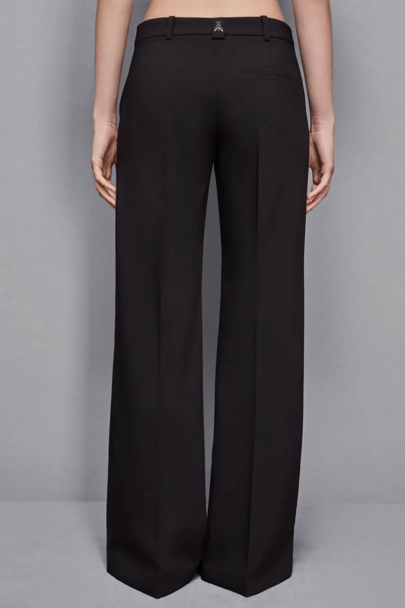 Pantaloni vita bassa in twill