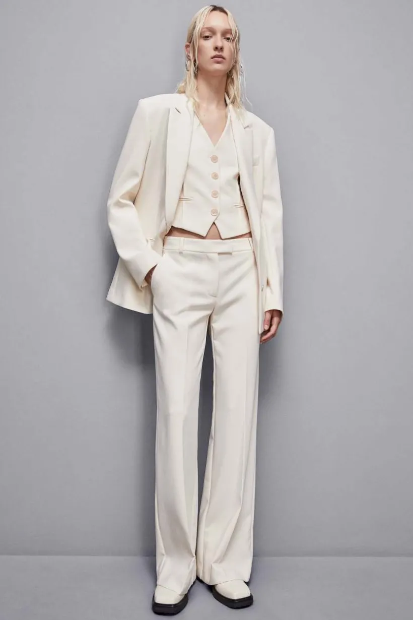 Pantaloni vita bassa in twill