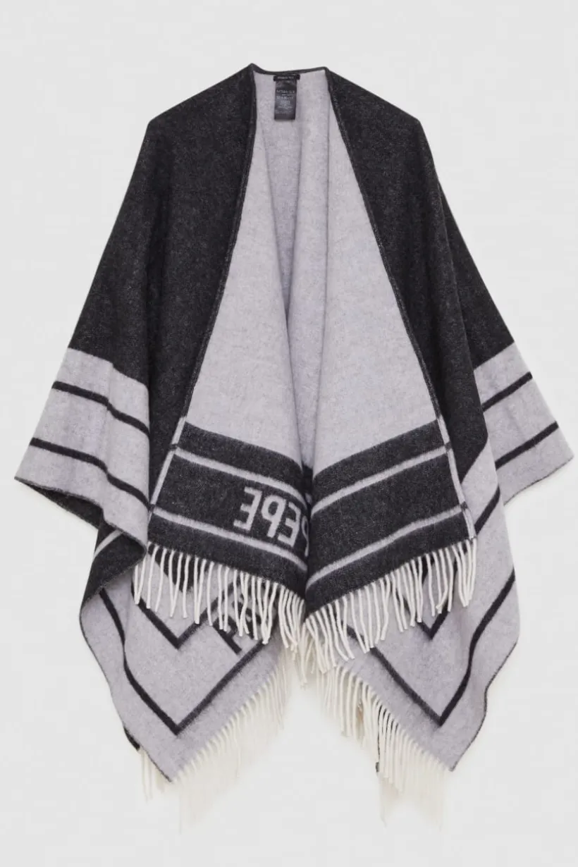 Poncho double face con frange