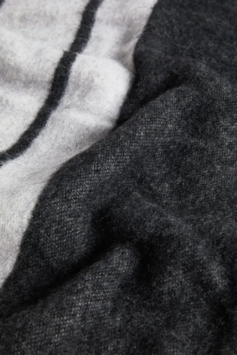 Poncho double face con frange