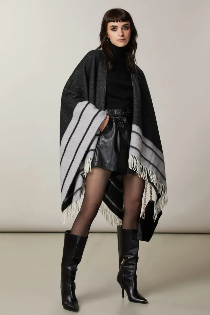 Poncho double face con frange
