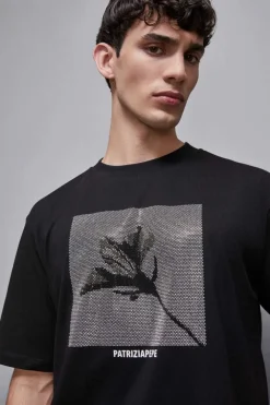 T-shirt con applicazione borchie